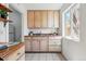 Bright kitchen with light cabinets, updated appliances, and a window that provides natural light at 4740 Milwaukee St, Denver, CO 80216