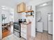 Open kitchen view with modern appliances and adjacent dining area, creating a seamless living space at 4740 Milwaukee St, Denver, CO 80216