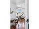 Inviting living area with bright window, hardwood floors, comfortable armchair, and modern decor at 4740 Milwaukee St, Denver, CO 80216