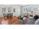 Stylish living room area with a bay window, comfortable seating, and hardwood floors at 4740 Milwaukee St, Denver, CO 80216