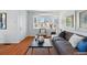 Well-lit living room featuring modern decor, comfortable seating, and a bright atmosphere at 4740 Milwaukee St, Denver, CO 80216
