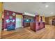 Finished basement wet bar area with beautiful countertops, wood cabinets and hardwood floors at 15958 Shadow Mountain Ranch Rd, Larkspur, CO 80118