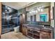 Well-lit bathroom with a glass-enclosed shower, modern vanity, and stylish fixtures at 15958 Shadow Mountain Ranch Rd, Larkspur, CO 80118