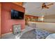 Cozy bedroom loft features a rustic accent wall and comfortable furnishings at 15958 Shadow Mountain Ranch Rd, Larkspur, CO 80118