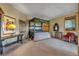 Spacious bedroom featuring unique furniture, carpeted floors, a window, and neutral paint, creating a calming retreat at 15958 Shadow Mountain Ranch Rd, Larkspur, CO 80118
