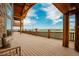 Expansive deck with wooden railings, scenic views of the surrounding landscape, and ample space for entertaining at 15958 Shadow Mountain Ranch Rd, Larkspur, CO 80118