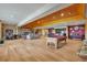 An expansive game room with a fireplace, wet bar, and pool table offers space for entertaining guests at 15958 Shadow Mountain Ranch Rd, Larkspur, CO 80118