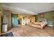 Open living room with hardwood floors, a sliding barn door, and modern decor, creating a welcoming space at 15958 Shadow Mountain Ranch Rd, Larkspur, CO 80118