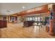 Expansive living room features hardwood floors, fireplace, and abundant natural light for a welcoming atmosphere at 15958 Shadow Mountain Ranch Rd, Larkspur, CO 80118