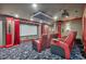 Enjoy movies in this ultimate theater room with a projector screen, comfortable seating, and custom design at 15958 Shadow Mountain Ranch Rd, Larkspur, CO 80118