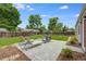 Backyard with a patio, green grass and trees at 3278 S Forest St, Denver, CO 80222