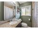 Bathroom featuring a granite vanity, neutral wall paint and a shower with a plaid shower curtain at 3278 S Forest St, Denver, CO 80222