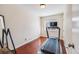 Bedroom with a treadmill, hardwood floors, and natural light at 3278 S Forest St, Denver, CO 80222