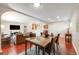 Open-concept dining area with a dining table, modern decor, and seamless access to the living space at 3278 S Forest St, Denver, CO 80222