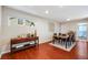 Spacious dining area with natural light, wood floors, modern furniture, and seamless flow to other rooms at 3278 S Forest St, Denver, CO 80222