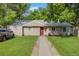 Charming single-story home featuring a well-maintained lawn, inviting walkway, and mature trees at 3278 S Forest St, Denver, CO 80222