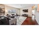 Inviting living room with a plush gray sofa, large window, built in shelving, and modern entertainment center at 3278 S Forest St, Denver, CO 80222