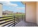A balcony with views of green space and townhomes, providing an outdoor living area at 11142 Bella Vita Dr, Broomfield, CO 80020