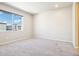 This carpeted bedroom offers a large window with neighborhood views and is ready for your personal touches at 11142 Bella Vita Dr, Broomfield, CO 80020