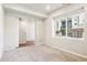 Bright, carpeted room with large window offering natural light at 11142 Bella Vita Dr, Broomfield, CO 80020