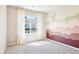 Bedroom showcasing light walls, one painted wall, a decorative hanging, and a window at 11142 Bella Vita Dr, Broomfield, CO 80020