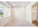 Neutral-toned bedroom with a large window and attached bath at 11142 Bella Vita Dr, Broomfield, CO 80020
