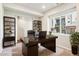 Well-lit home office with a large window, desk, and built-in shelving at 11142 Bella Vita Dr, Broomfield, CO 80020