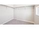 The walk-in closet provides ample storage space with shelving, racks, and a window for natural light at 11142 Bella Vita Dr, Broomfield, CO 80020