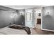 Well-lit bedroom leads to bathroom with neutral decor at 543 N Marion St, Denver, CO 80218