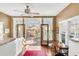 Dining area with hardwood floors, large windows, and an open doorway to an outdoor patio at 543 N Marion St, Denver, CO 80218