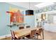 Stylish dining room featuring a wooden table, modern lighting, and artistic wall decor at 543 N Marion St, Denver, CO 80218