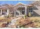 Traditional home with a brick facade, front porch, and classic architectural details with landscaped front yard at 543 N Marion St, Denver, CO 80218