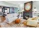 Cozy living room with a fireplace, plush seating, and a decorative rug and a view to dining area at 543 N Marion St, Denver, CO 80218