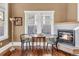 Living room featuring hardwood floors, fireplace and large window at 543 N Marion St, Denver, CO 80218