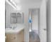Well-lit bathroom with a modern vanity and a shower/tub combination at 10699 Butte Dr, Longmont, CO 80504