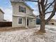 Charming two-story home with light-colored siding and a covered front porch at 10699 Butte Dr, Longmont, CO 80504