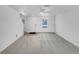 Spacious living area offers an open floorplan with natural light and neutral carpeting at 10699 Butte Dr, Longmont, CO 80504