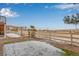 Well-maintained backyard featuring a white picket fence, rock garden, and a partial view of the adjacent street at 3659 Makley Cir, Castle Rock, CO 80104