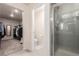 Bright bathroom with a walk-in closet, separate toilet room and glass enclosed shower at 3659 Makley Cir, Castle Rock, CO 80104