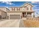 Inviting two-story home with a covered porch and a two car garage and well-maintained landscaping at 3659 Makley Cir, Castle Rock, CO 80104