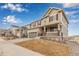 Charming two-story home with a covered front porch and well-manicured lawn in a peaceful neighborhood at 3659 Makley Cir, Castle Rock, CO 80104