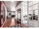 Spacious hallway leading to a well-lit office and living area, complemented by hardwood flooring at 3659 Makley Cir, Castle Rock, CO 80104