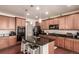 Spacious kitchen with island, pendant lights and stainless steel appliances at 3659 Makley Cir, Castle Rock, CO 80104