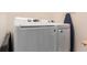 Bright laundry area with a large capacity, modern, white, front-load washer and dryer set at 3659 Makley Cir, Castle Rock, CO 80104
