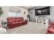Spacious living room featuring a large TV, comfortable seating, and modern decor at 3659 Makley Cir, Castle Rock, CO 80104