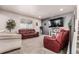 Comfortable living room with plush seating, a large TV, and neutral decor, ideal for relaxation at 3659 Makley Cir, Castle Rock, CO 80104