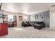 Relaxing Gathering room with plush sofa and large windows at 3659 Makley Cir, Castle Rock, CO 80104