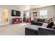 Living area with comfortable seating and entertainment center at 3659 Makley Cir, Castle Rock, CO 80104