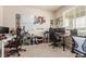 Bright office space with multiple desks, perfect for productivity and organization at 3659 Makley Cir, Castle Rock, CO 80104