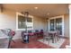 Outdoor patio with seating area, heaters, and a grill at 3659 Makley Cir, Castle Rock, CO 80104